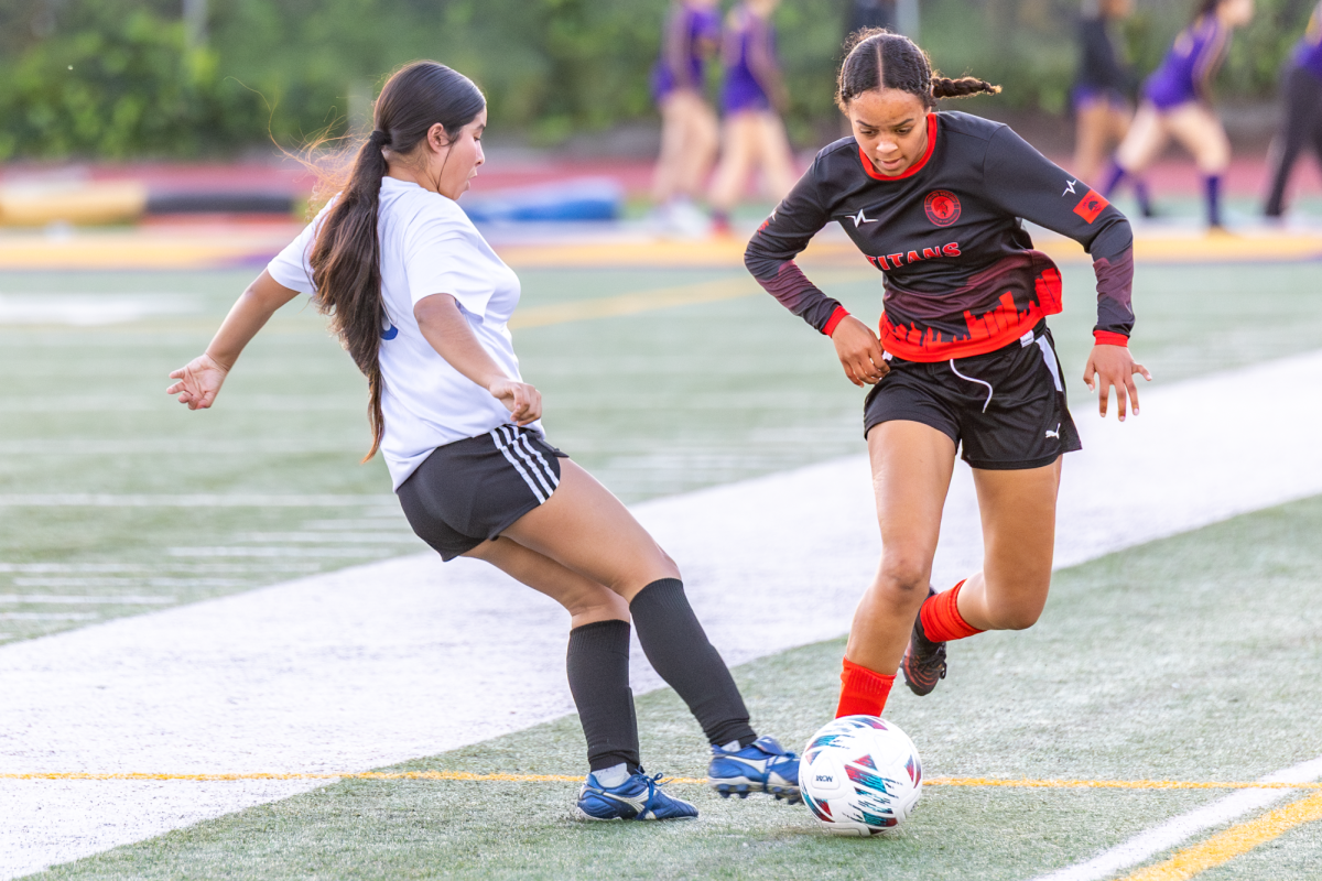 Senior Kaniah Herron and Kipp King player both fighting for possession over the ball during play. The game took place in Oakland techs field which ultimately ended in a loss.